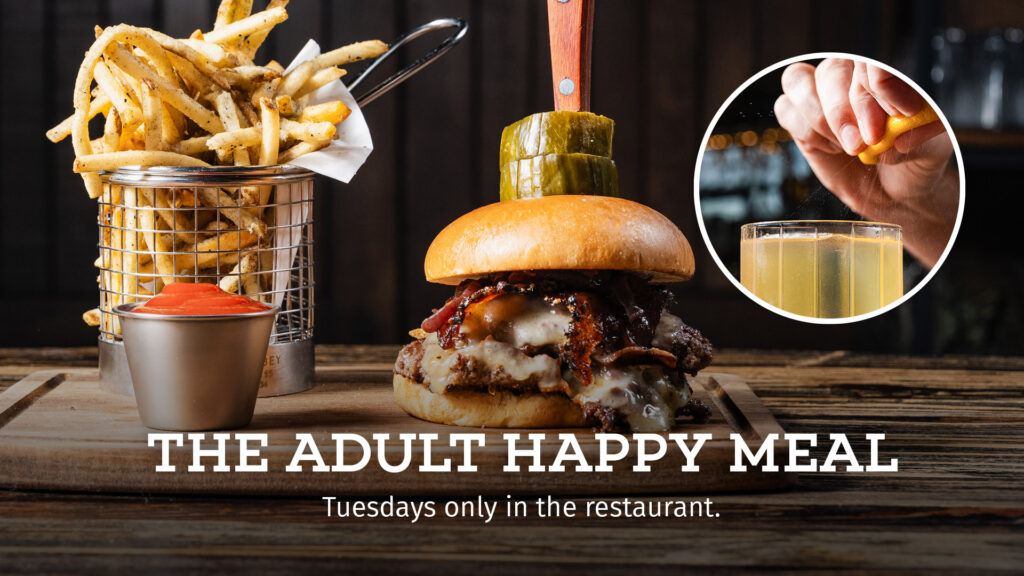 Double Smashed Burger and Hawaiian Black Salted Fries with a signature cocktail at Bottled in Bond in Frisco, Texas