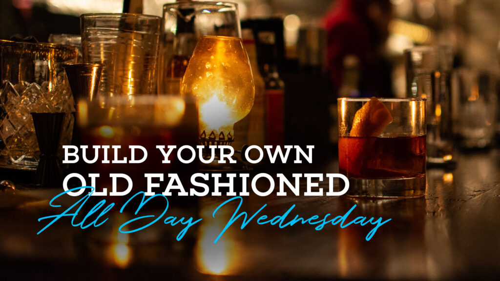 Picture of an old fashioned cocktail on top of the bar at Bottled in Bond Cocktail Parlour and kitchen. The text on top of the picture says Build Your Own Old Fashioned All Day Wednesday.